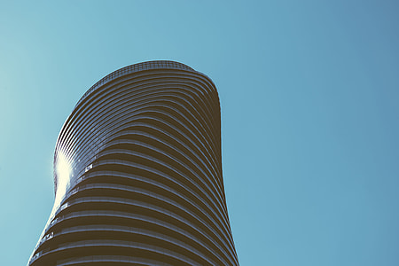 low angle photography of spiral building during daytime thumbnail