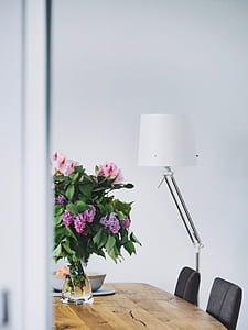 purple and white flower on brown table thumbnail