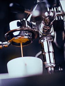 Espresso Machine Extracting Coffee and Dripping in White Cup thumbnail