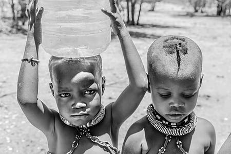grayscale photography of two topless boys thumbnail