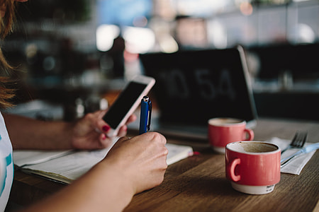 Young woman working in a cafe thumbnail