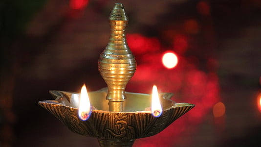 gray and brown incense holder with two lighted incense sticks thumbnail