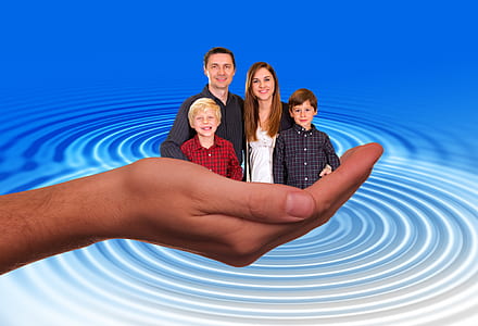 smiling man, woman, and two boys thumbnail