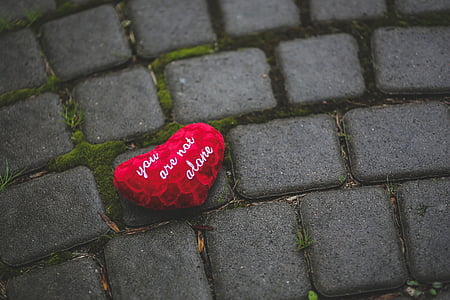 photo of red heart with text on gray pavement thumbnail