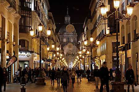 group of people walking on street walk with street lights during nighttime thumbnail