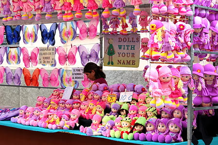 assorted-color doll and butterfly wing display during daytime thumbnail