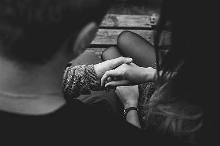 grey scale photo of couple holding hands thumbnail