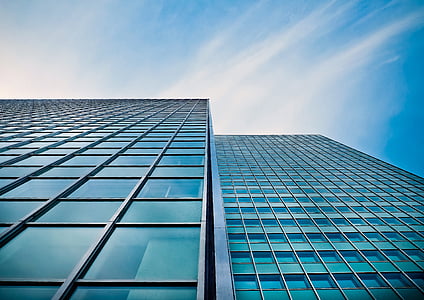 low-angle photography of glass buildings thumbnail