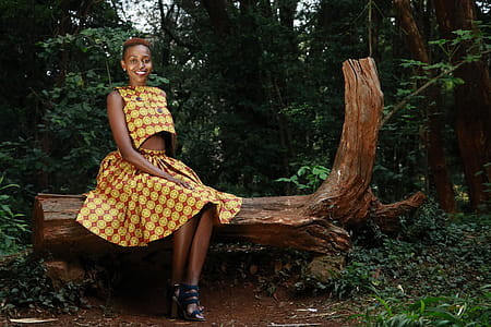 Woman Siting on Tree Log thumbnail
