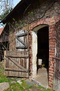 opened door red concrete wall brick house thumbnail