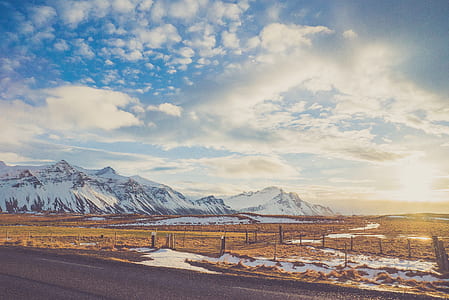 asphalt road towards mountain alps thumbnail