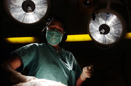 person wearing medical mask and teal scrub shirt thumbnail