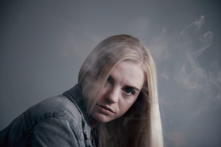 closeup photography of woman wearing blue denim top thumbnail