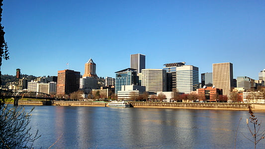 photography of body of water and buildings during daytime thumbnail