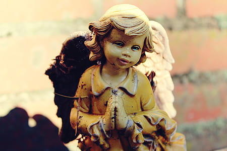 yellow dressed angel figurine thumbnail
