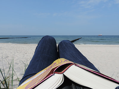 person lying beside seashore thumbnail