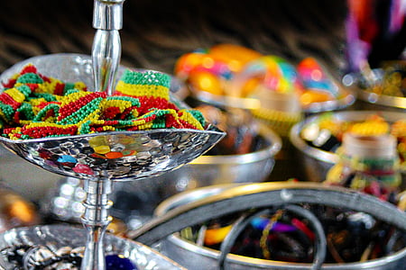 selective focus photography of beads in silver-colored container thumbnail