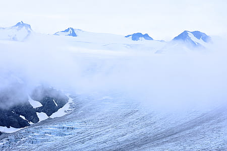 high-angle photography of mountain near clouds thumbnail