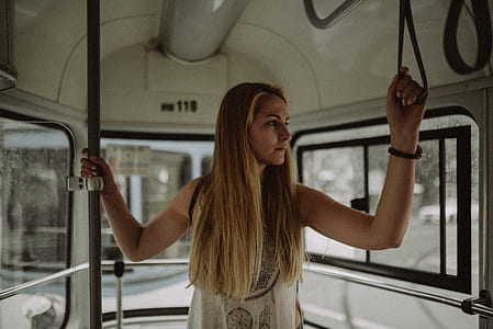 woman holding rubber inside the bus thumbnail