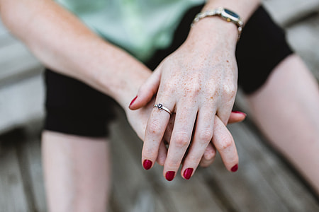 Detail of woman's hands and jewelry thumbnail