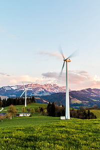white wind turbines with mountain at distance at daytime thumbnail