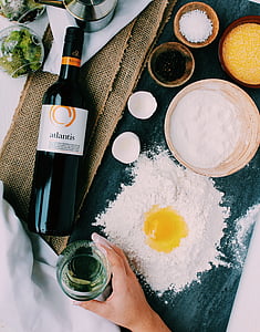 Atlantis bottle near white dough with egg yolk thumbnail