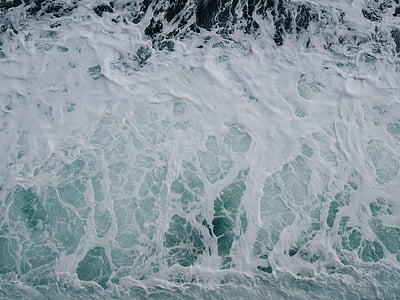 birds eye photography of sea waves thumbnail