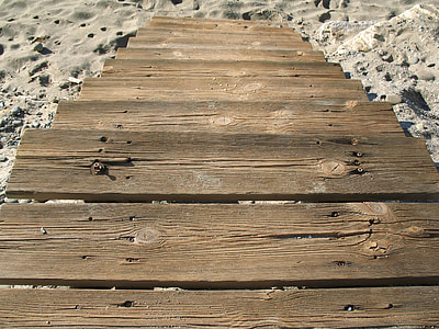 brown wooden stair during daytime thumbnail