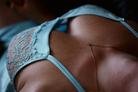 woman in teal nighties wearing gold-colored necklace thumbnail