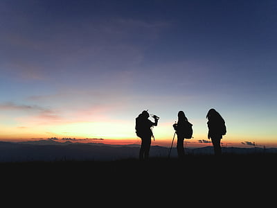 silhouette of three person standing thumbnail