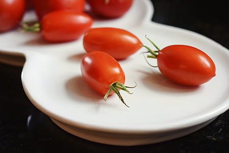 plate of oval red fruit thumbnail