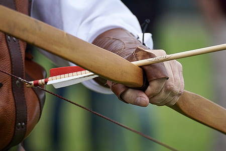 person holding recurve bow with arrow thumbnail