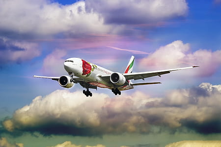white and red airbus flying under cloudy sky thumbnail