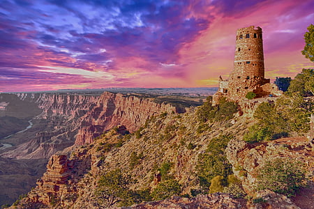 brown concrete tower on rocky mountain thumbnail