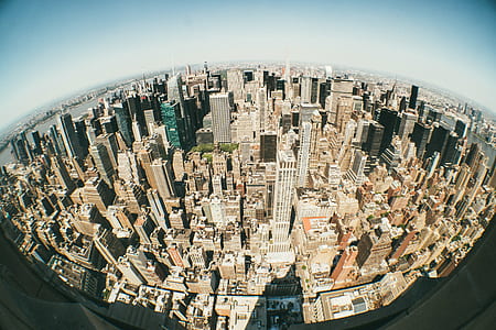 high-angle photography of high-rise buildings under white and blue sky at daytime thumbnail
