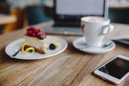 Working in a restaurant: Macbook, Cheese Cake and Cup of Coffee thumbnail