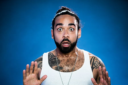 Surprised Tattooed Young Man Photo thumbnail