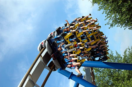 people riding on roller coaster thumbnail