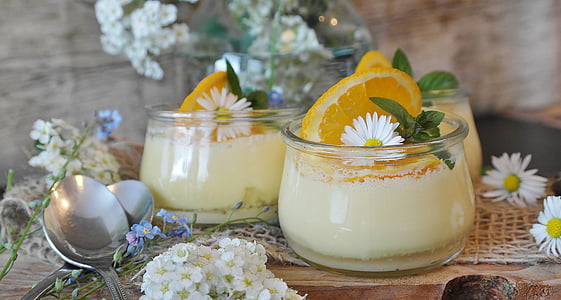clear glass jars with slice of lemons and yellow cream thumbnail
