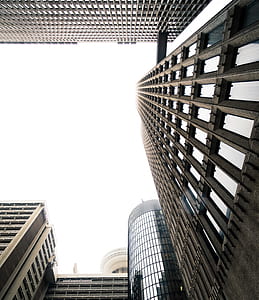 lowangle photography of gray concrete city high-rise buildings at daytime thumbnail