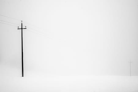 black utility post in snowfield thumbnail