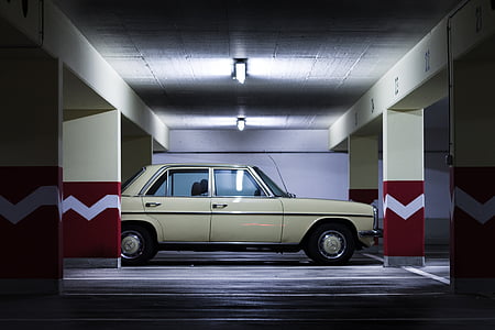sedan parked in parking lot thumbnail