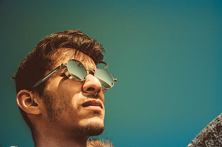 selective photography of man wearing hippie sunglasses thumbnail