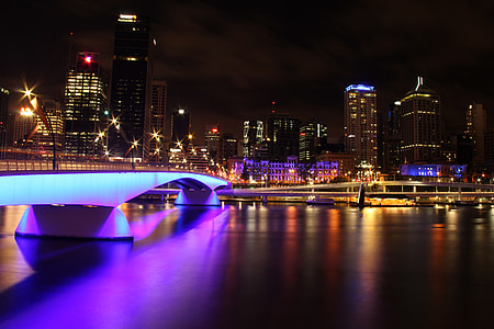 lighted concrete buildings at night thumbnail