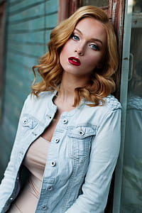 woman in beige scoop-neck top and blue button-up jacket thumbnail