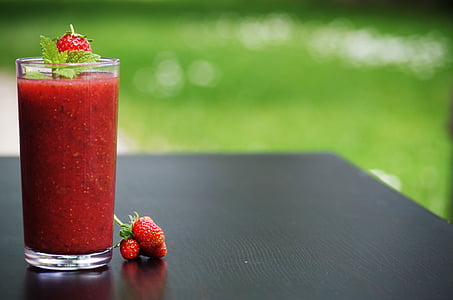 clear drinking glass full of strawberry juice thumbnail