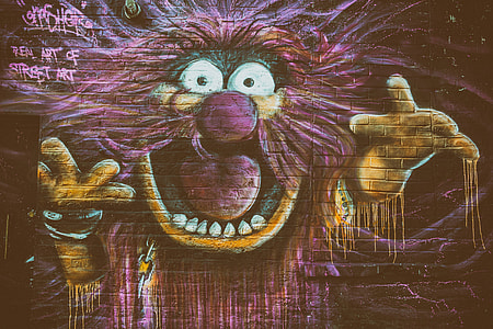 Street art depicting The Animal character from The Muppets captured on a brick wall thumbnail