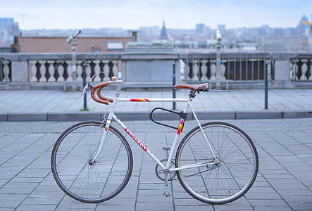 white and orange road bike thumbnail