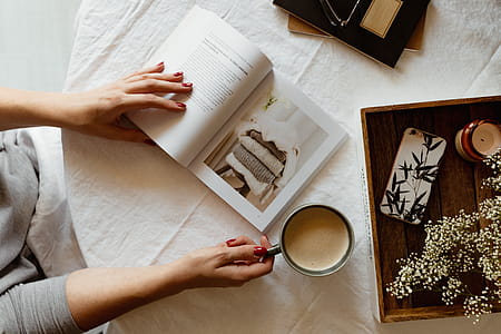 Woman read book and drink coffee thumbnail