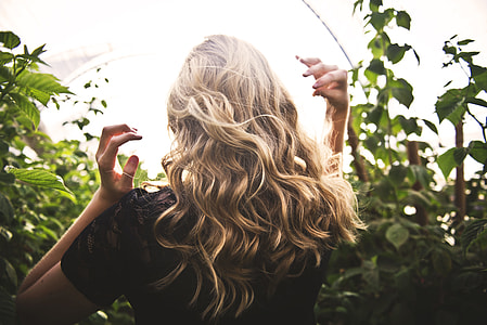 woman surrounded by green leaves thumbnail
